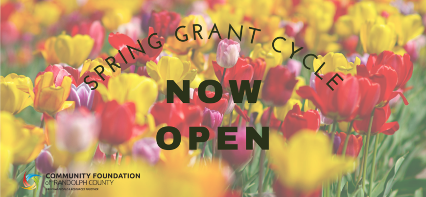 Image of a field of tulips with the text about Spring Grant Cycle accepting applications.